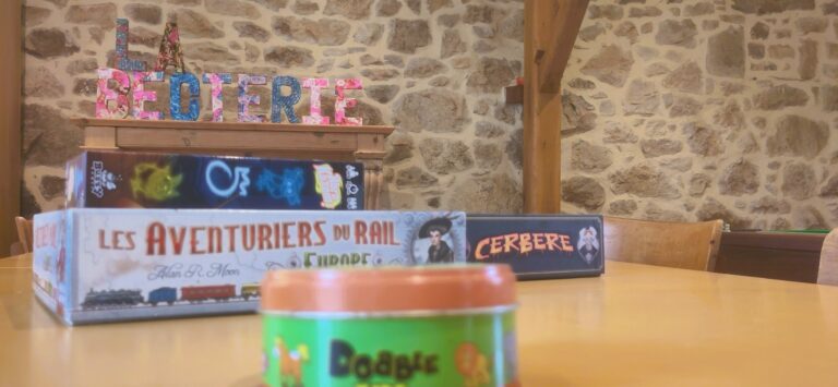 Some of the many board games arranged on the table dedicated to game events.