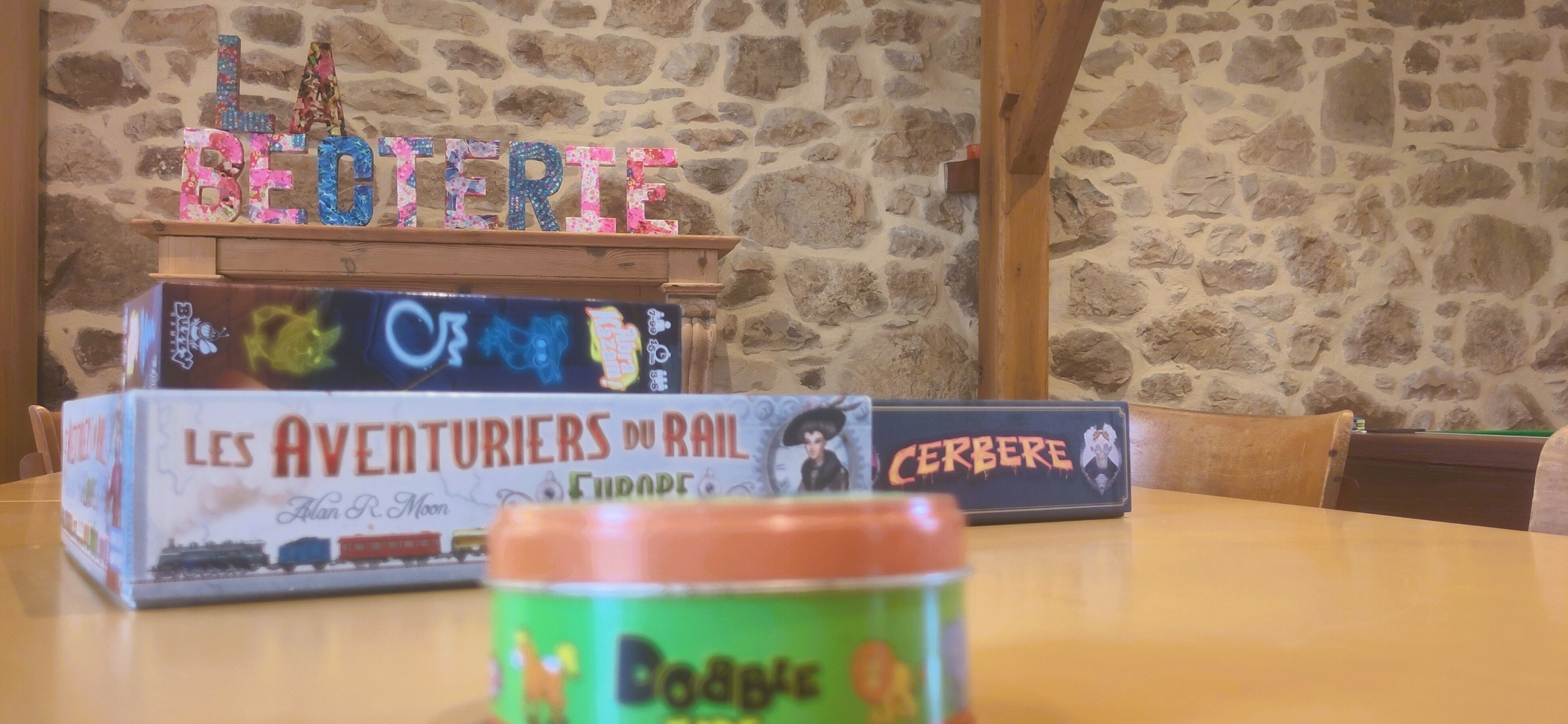 Some of the many board games arranged on the table dedicated to game events.