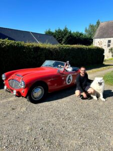 Red Austin vintage car at La Becterie