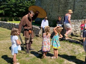 Kids enjoying the medieval ambiance at Pirou Castle